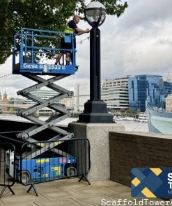 a man on a Electric Scissor Lift